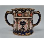 A Royal Crown Derby porcelain twin handled vase, gilt floral decorated in arched panels, maker's