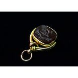 An 18ct gold fob, inset bloodstone and agate and carved with Fitzgerald monkey and chain seal