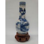 A late 19th century Chinese porcelain mallet shaped blue and white vase decorated with figures in