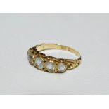 A 15ct gold ring set five graduated white sapphires, size N.