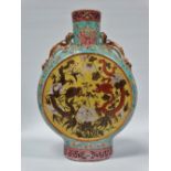 A 19th century famille rose moon flask, the sides of the body painted with stylised lotus designs in