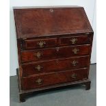 A George II style walnut bureau of small proportions, with fitted interior over an arrangement of