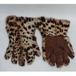 A pair of ladies leopard skin and brown leather driving gloves.