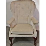 An early George III style walnut and upholstered armchair with cabriole legs.