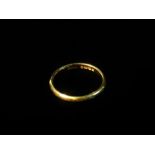 A 22ct gold wedding band, size L, weight 2.3g approximately.