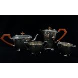 A four piece silver plated tea service, consisting of a teapot, hot water jug, cream jug and sugar