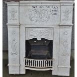 A late 19th century cast iron fire surround in Art Nouveau style, decorated with scrolling floral