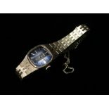 A Seiko ladies stainless steel bracelet manual wind wristwatch, the square blue metallic 13mm dial