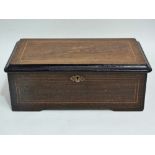 A late 19th century four aire musical box in a rosewood and boxwood inlaid case, height 12.5cm,