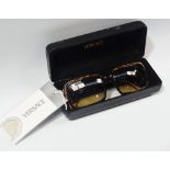 A pair of Versace sunglasses, Mod. 4022 208/18 55 17 135, in original hard case, with certiciate