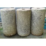 Three Cornish granite rollers, height 62cm.