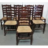A set of eight Lancashire style rush seated dining chairs with turned frames.