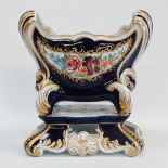 A Sevres style porcelain centrepiece, with hand painted floral decoration and gilded highlights,