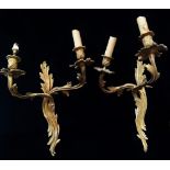 A pair of gilt bronze twin branch wall lights in Rococo style, height 40cm.