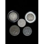 A Victorian silver half crown 1885, together with two others 1890 and 1896 and a George III two