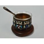 An Imperial Russian silver gilt and cloisonne enamel salt cellar, associated clear glass liner.