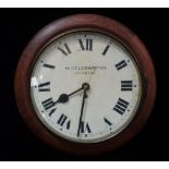 An early 20th century wall clock dial marked W. Goldsworthy Newquay, lacks original mechanism,