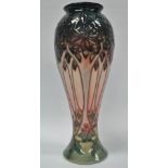 A Moorcroft inverted baluster vase decorated poppies in a woodland landscape, impressed and