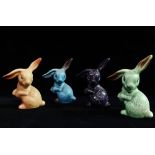 Four Sylvac floppy eared rabbit figures, largest height 14cm.