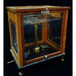 A L. Oertling Model 48 laboratory balance scales in fitted mahogany case with broad arrow mark,