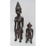 Two West African carved wood figures, largest height 51cm.