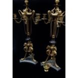A pair of late 19th century Aesthetic Movement gilt brass and slate six light candelabra with