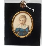 MINIATURE - A 19th century oval miniature on card of a young boy in a blue suit, titled to reverse '