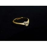 An 18ct gold diamond solitaire ring, the diamond of 0.20 carat spread approximately, size M.