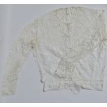 An Edwardian child's white lace blouse, length 47cm.