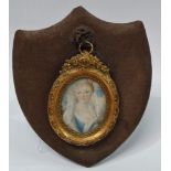 MINIATURE - A late 19th/early 20th century oval miniature on ivory of a young aristocratic French