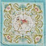 A Hermes Paris 'Cheval Turc' decorated silk scarf, on a pale blue ground with outer gilt scrolls, 88