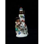 A Meissen porcelain scent bottle, circa 1900, modelled as a boy and goat around a tree stump, the