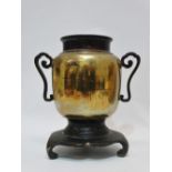 A Japanese polished bronze twin handled vase with silver inlaid scene of boats and cranes before