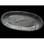 An Art Nouveau Kayserzinn pewter tray of oblong form, decorated in relief with a stylised carp,