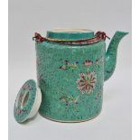 A Chinese porcelain Canton enamel teapot, the teal body decorated with famille rose lotus flowers