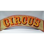 A painted wooden fairground style sign, 'CIRCUS', length 123cm.