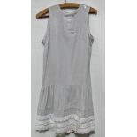 A Mary Quant grey 'Icecream' dress with front button and lace detail and back bow, dress label