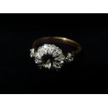 An 18ct gold white stone set ring, the central stone missing, stamped 750, size Q, weight 3.9g