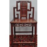 A 19th century Chinese hardwood side chair, the back decorated with a panel of bamboo above a