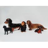 A large Beswick dachshund, length 23cm, together with two small Beswick dog figures, a Sylvac
