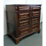A late 17th/early 18th century oak chest of drawers, the moulded top over four graduated mitre