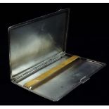 A silver engine turned cigarette case, with engraved monogram A.H.S., Birmingham 1945, weight 6.