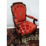 A 19th century French rosewood open armchair with scroll decorated frame and cabriole legs with