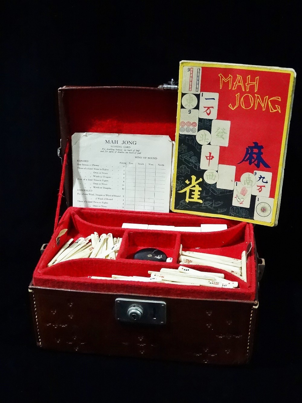 A mid 20th century Chinese Mah Jong set in fitted faux leather case, appears complete.