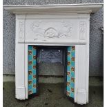 A late 19th century cast iron fire surround and grate decorated with flowering motifs, lacks