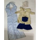 Early 20th century, a child's cream faux fur jacket with a blue velvet muff and skirt, together with