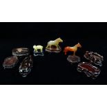 Three Chinese carved agate figures of horses, together with six carved hardwood jade stands.