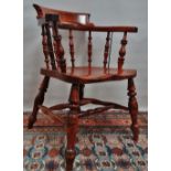 A Victorian turned sycamore captain's armchair with double H stretcher.