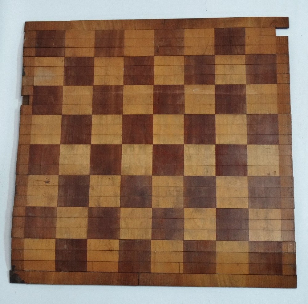 A 19th century, possibly campaign, tambour folding chess board with fabric backing, the board rolls