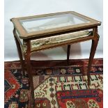 A late 19th century French kingwood and ormolu mounted bijouterie table, the glazed top with